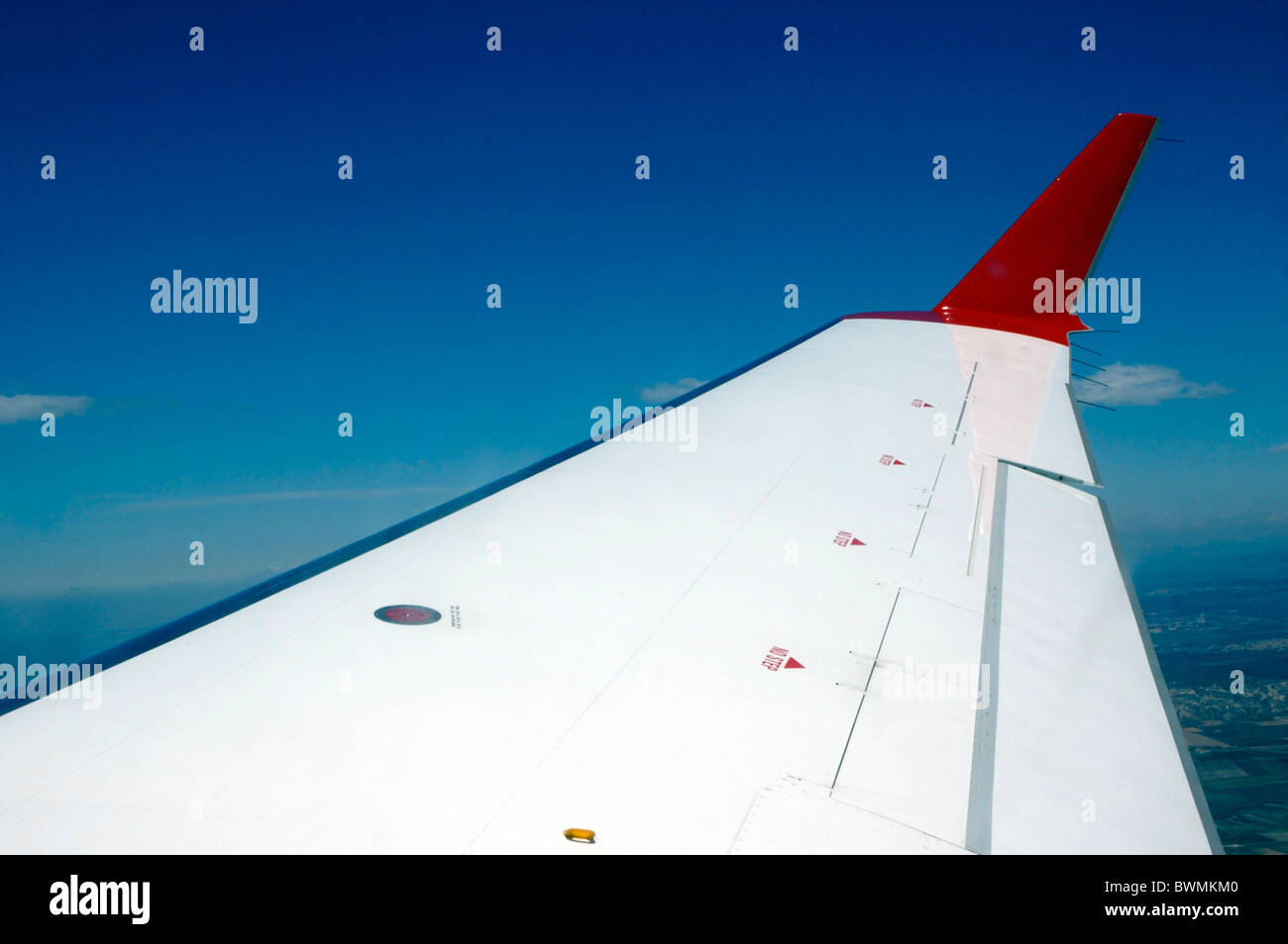 Wing of an airplane mid flight over Spain Stock Photo - Alamy