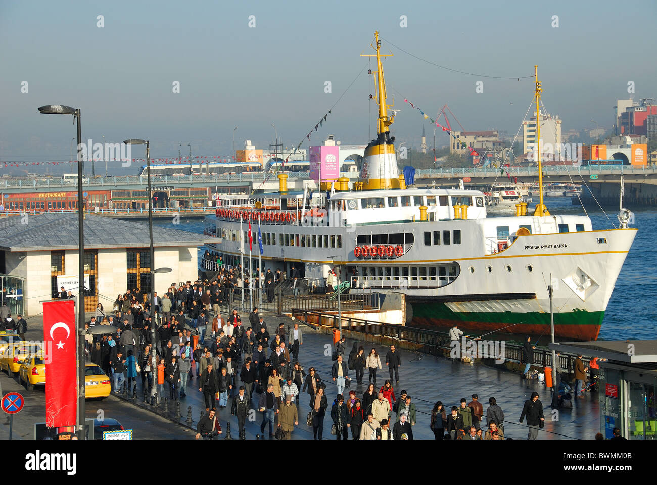 ISTANBUL, TURKEY. The Golden Horn waterfront at Eminonu, with morning commuters disembarking from a Bosphorus ferry. 2010. Stock Photo