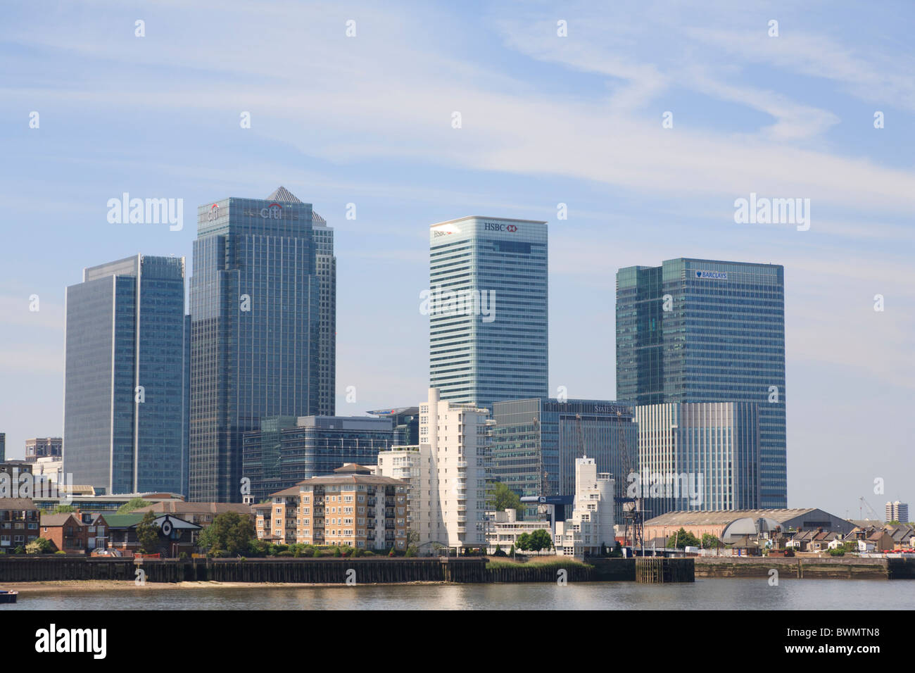 The Towers of Canary Wharf at Docklands with the river Thames in the