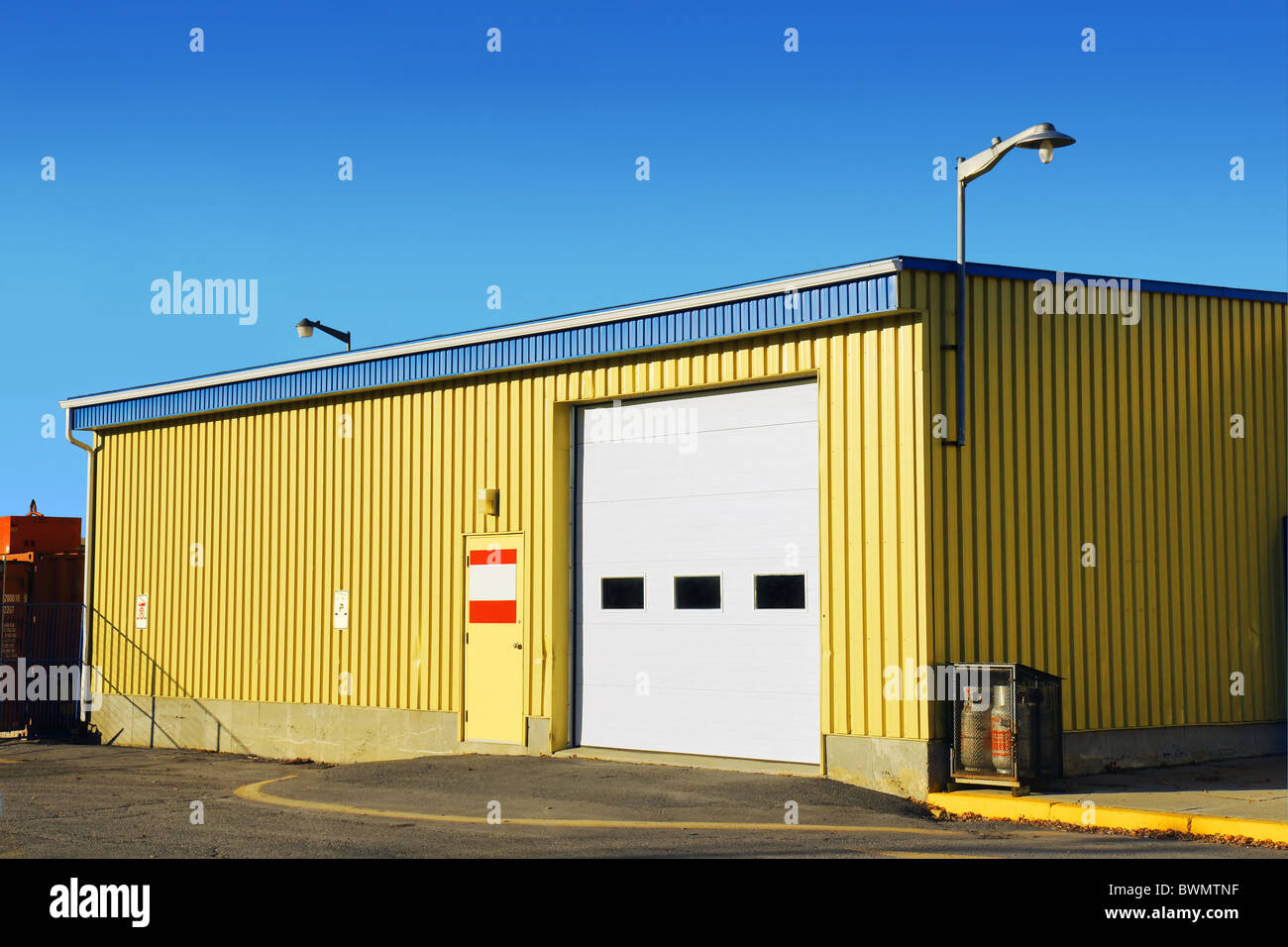 small corrugated yellow metal siding garage or arena Stock Photo Alamy