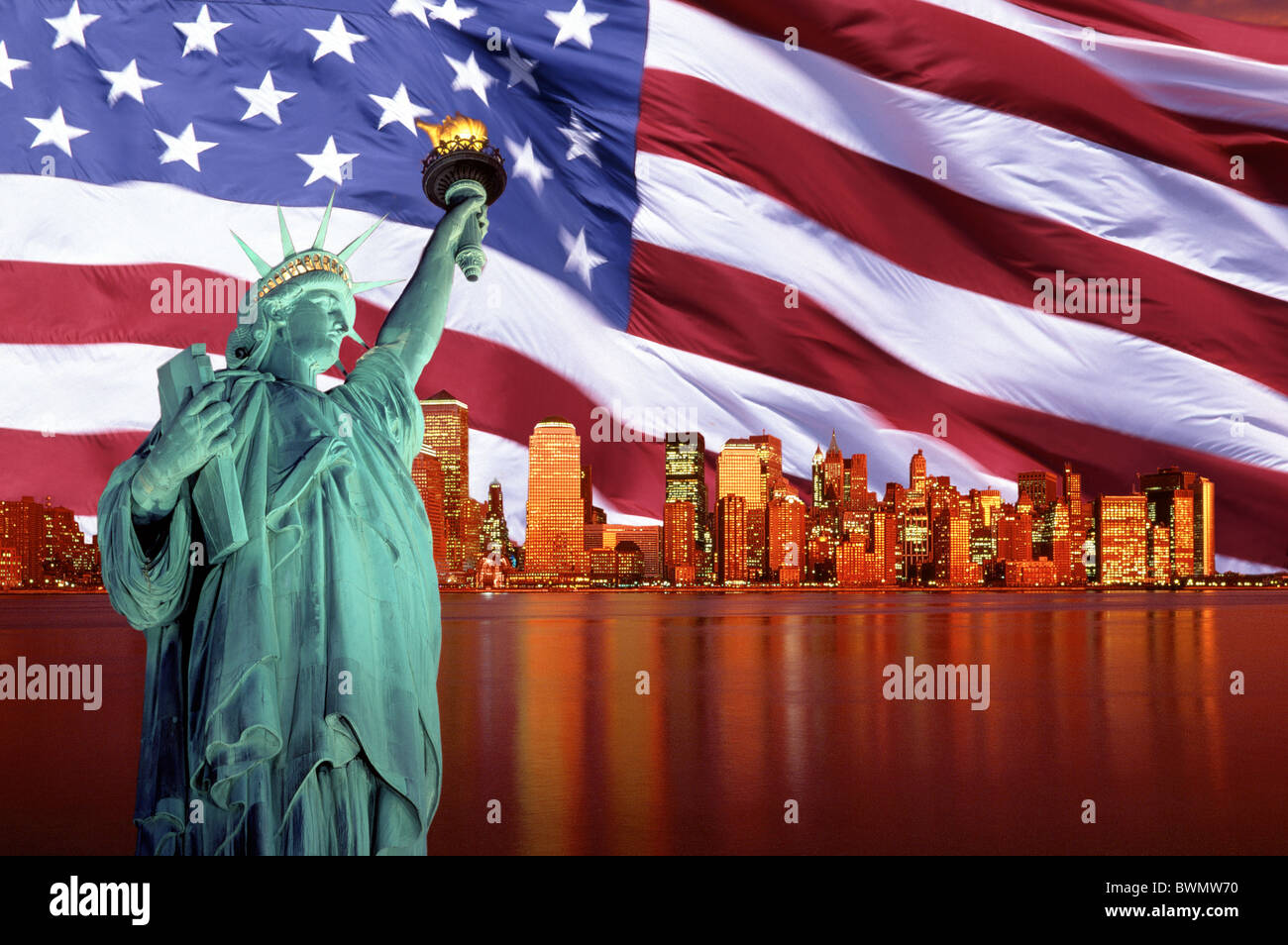 USA The Statue of Liberty Manhattan and the United States Flag in evening light Stock Photo