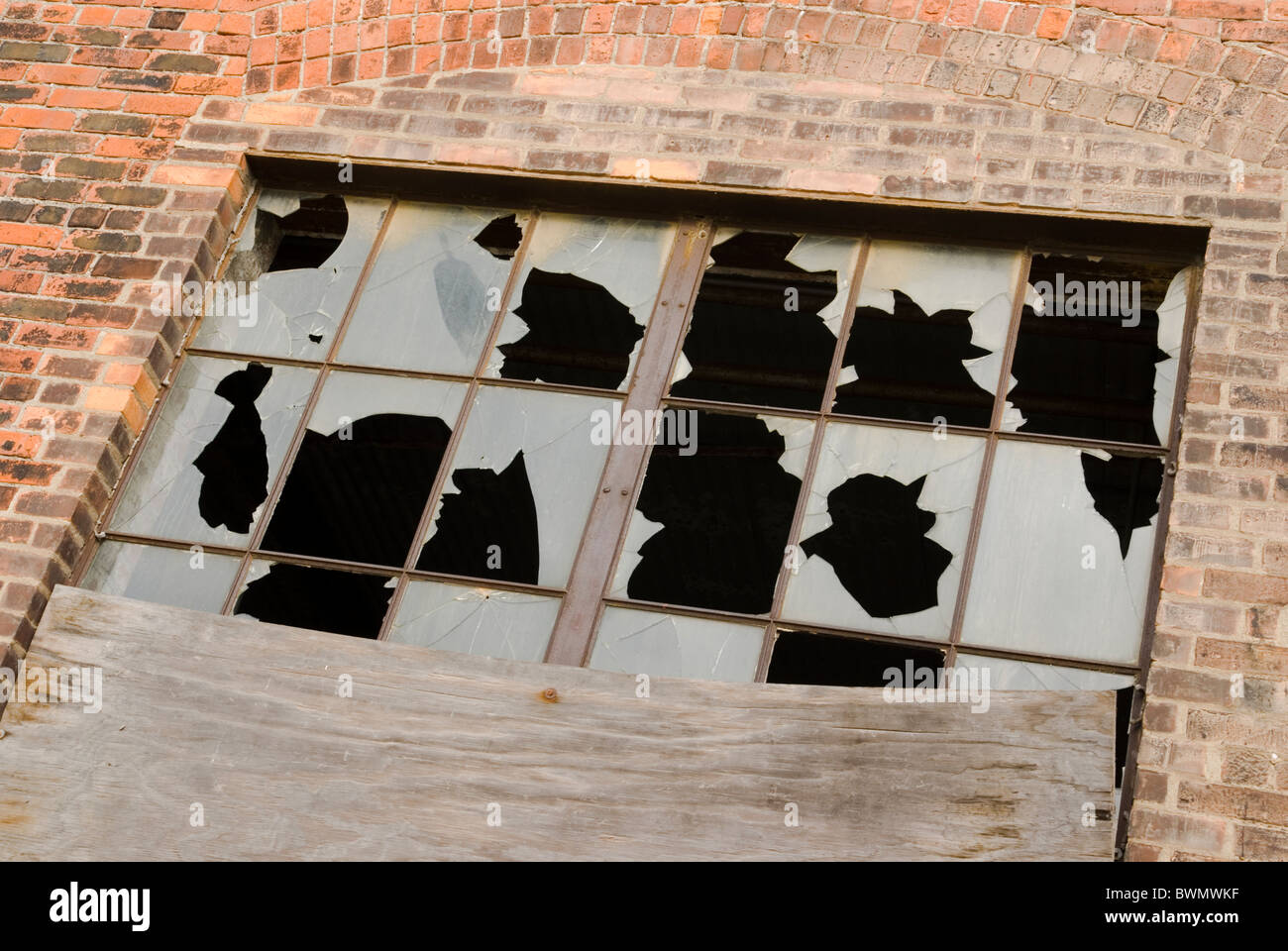 Smashed windows in an abandoned factory building. Detroit, Michigan, USA. Stock Photo
