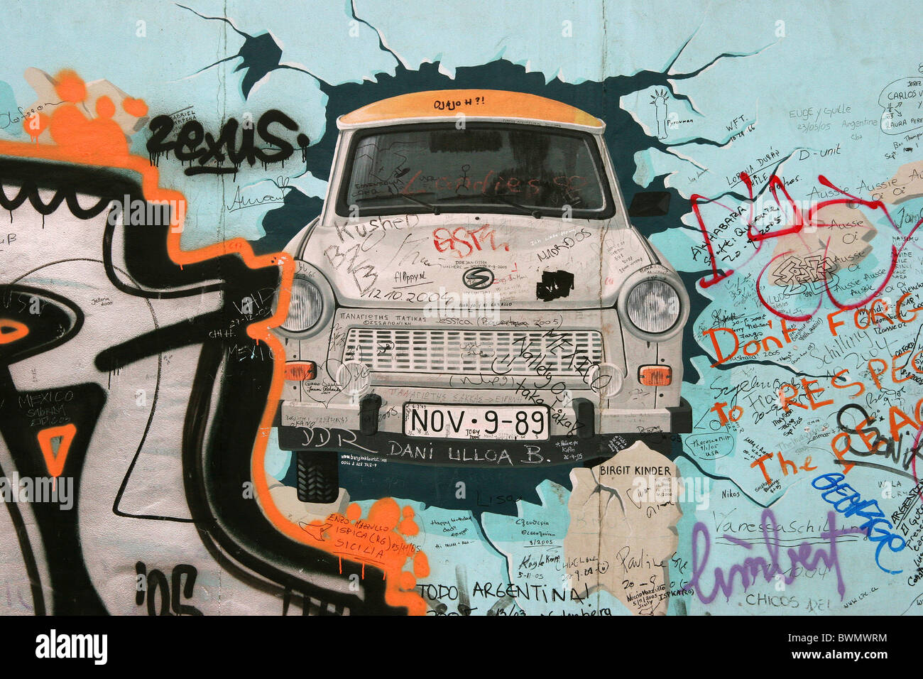 Fragment of Berlin wall - car breaking through to the freedom. Stock Photo