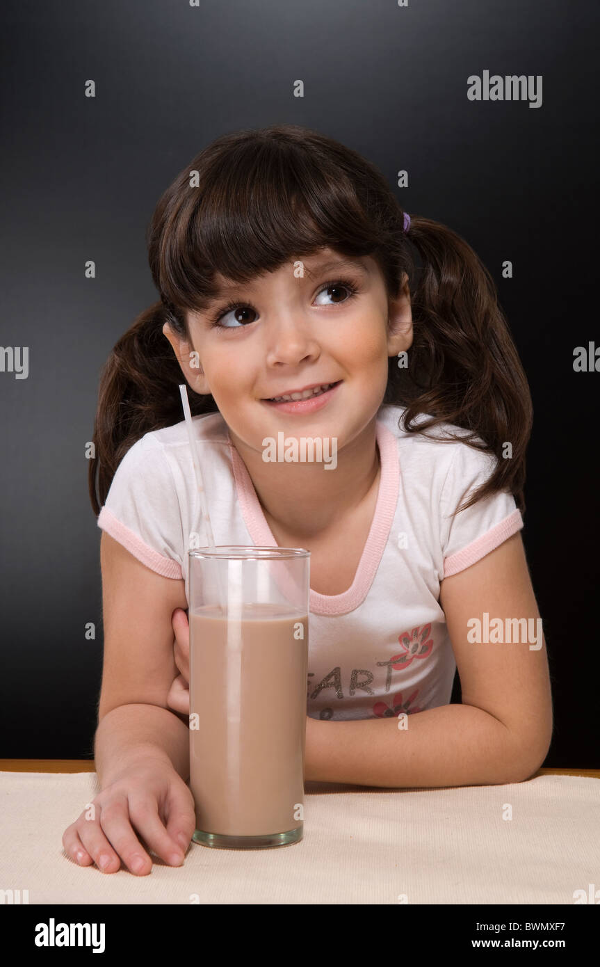 Girl with a glass of chocolate milk Stock Photo Alamy