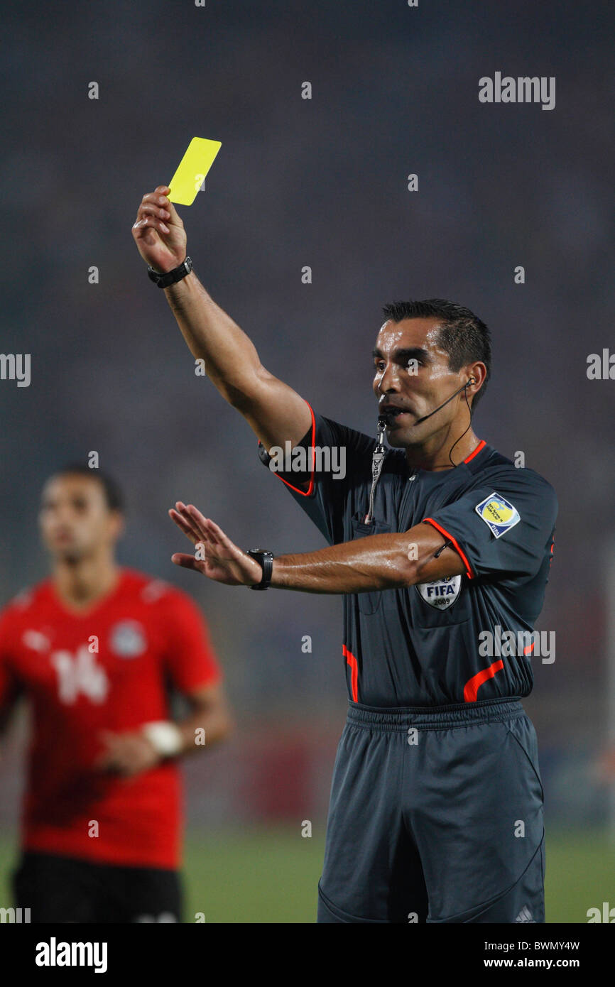 Referee Marco Rodriguez issues a yellow card caution during a 2009 FIFA U-20 World Cup Group A match between Italy and Egypt Stock Photo