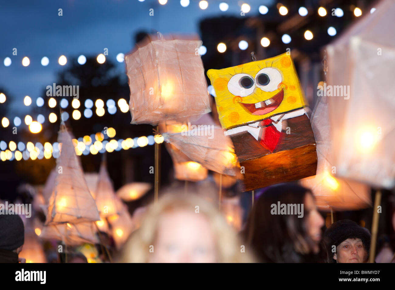 A lantern festival procession at the Christmas lights switch on in  Ambleside, Cumbria, UK Stock Photo - Alamy