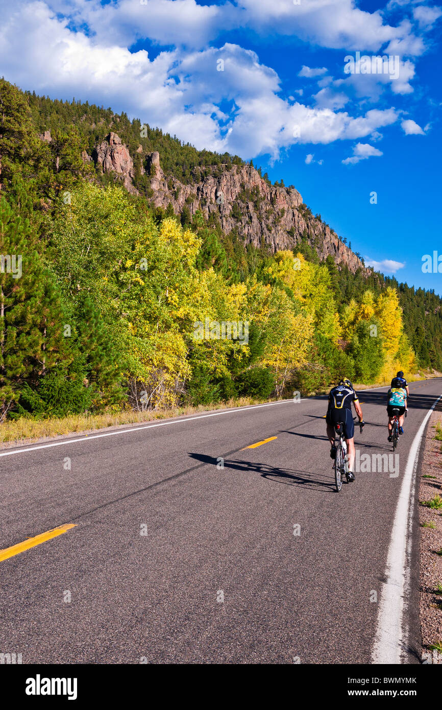 Cyclists passing the Rio Grande Palisades on Highway 149, Rio Grande