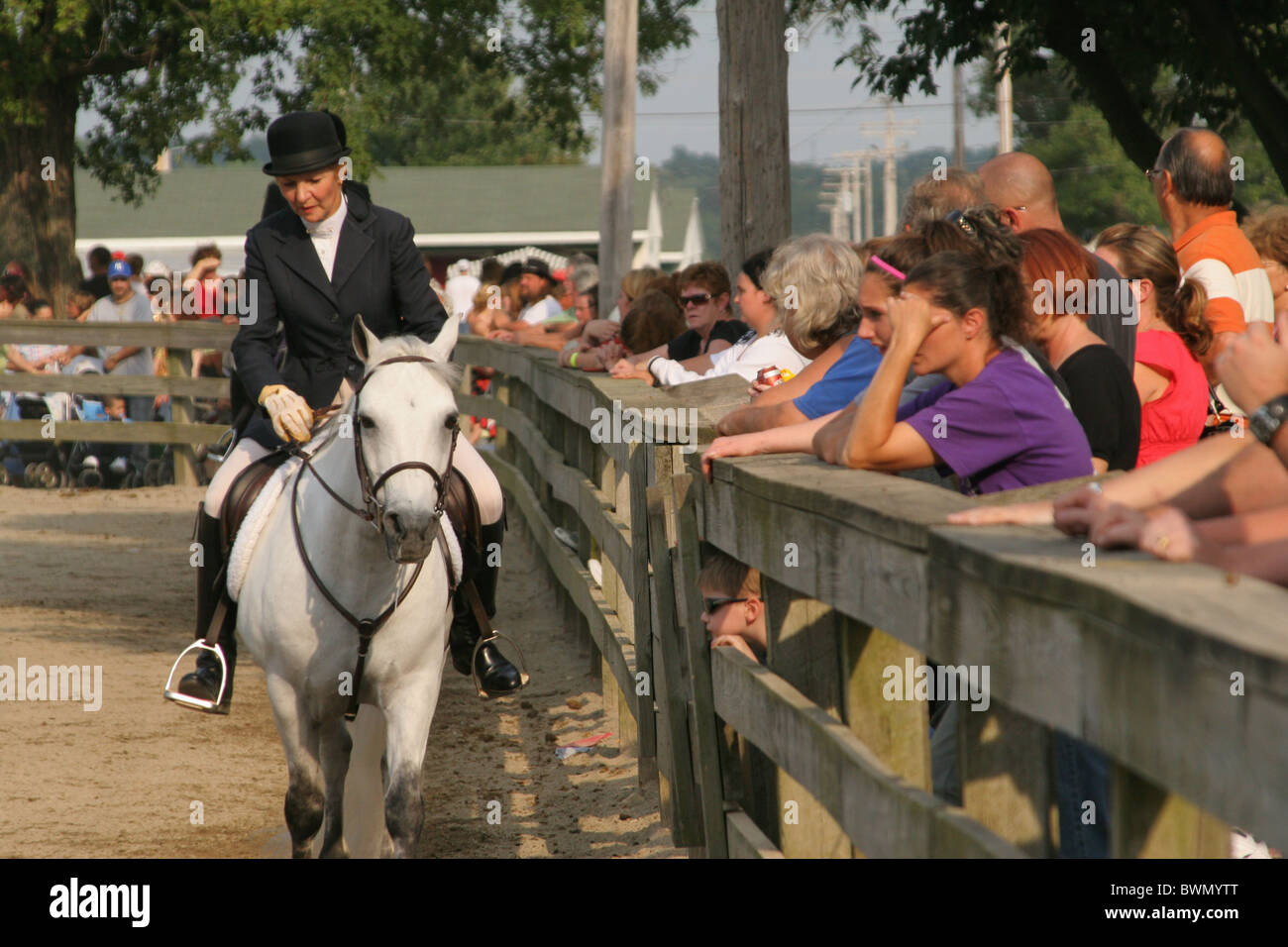 Horse showmanship contest. Woman riding horse in English apparel
