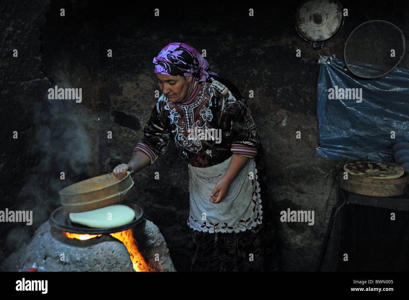 Marrakesh Morocco 2010 - Traditional berber home with women making tea and bread in the Ourika Valley at the Atlas Mountains Stock Photo