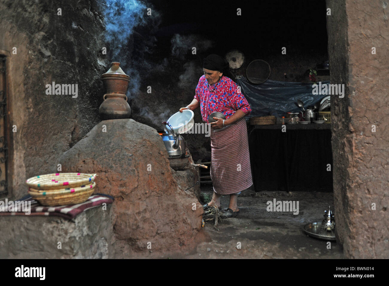 Marrakesh Morocco 2010 - Traditional berber home with women making tea and bread in the Ourika Valley at the Atlas Mountains Stock Photo