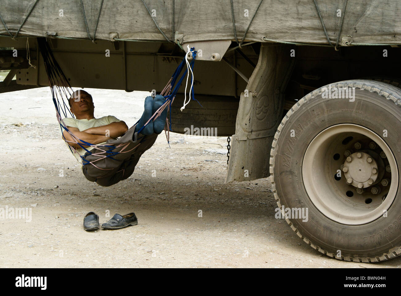 Man Sleeping In Hammock Under Truck ubicaciondepersonas.cdmx.gob.mx