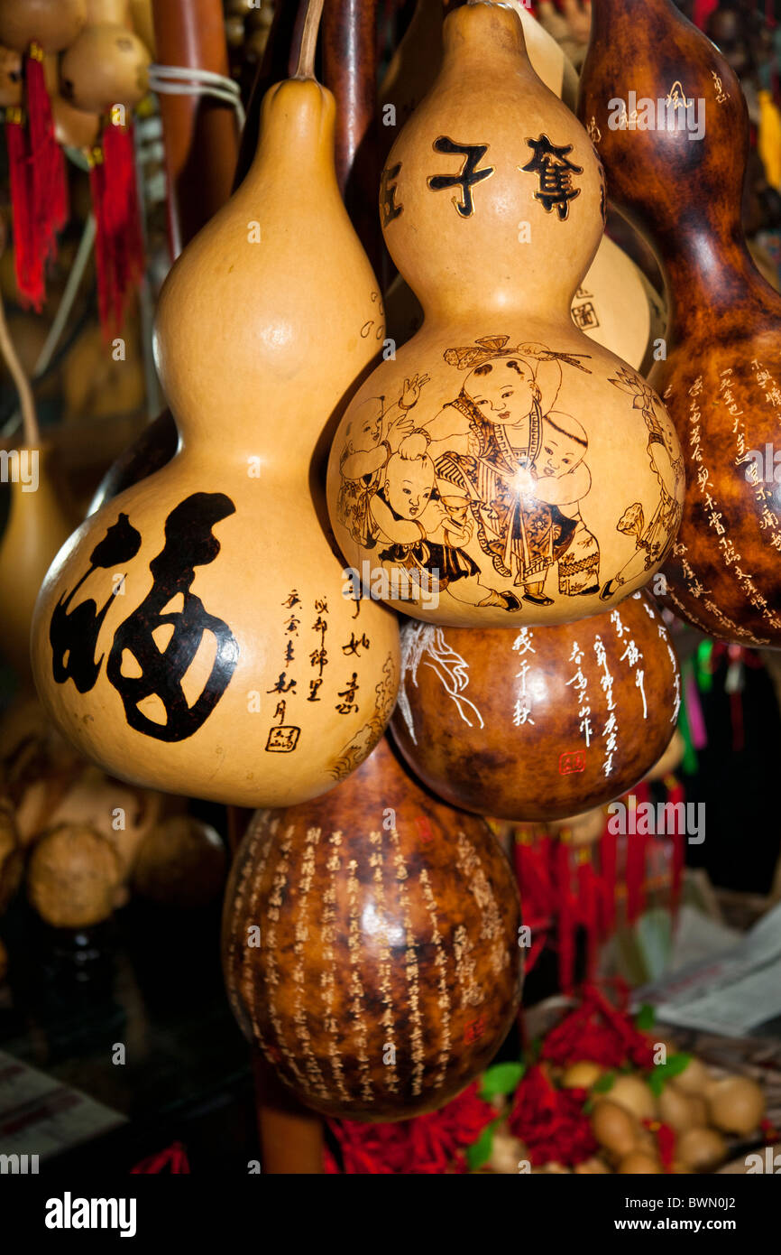 Decorated gourds for sale in a market, Chengdu, China Stock Photo