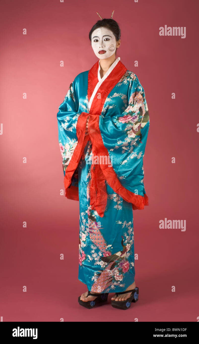 Asian female with geisha style face paint in yukata (kimono Stock Photo
