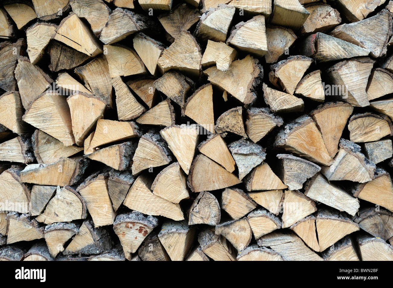 Stack pile of firewood logs for domestic fuel house fire heating Stock Photo