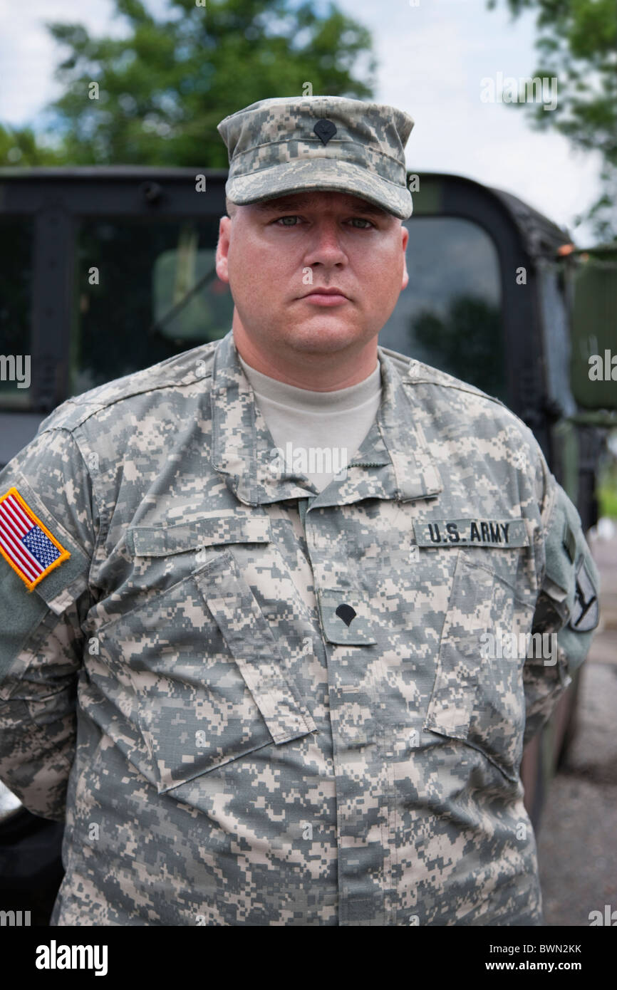Standing military army soldier looking at camera hands behind back hi