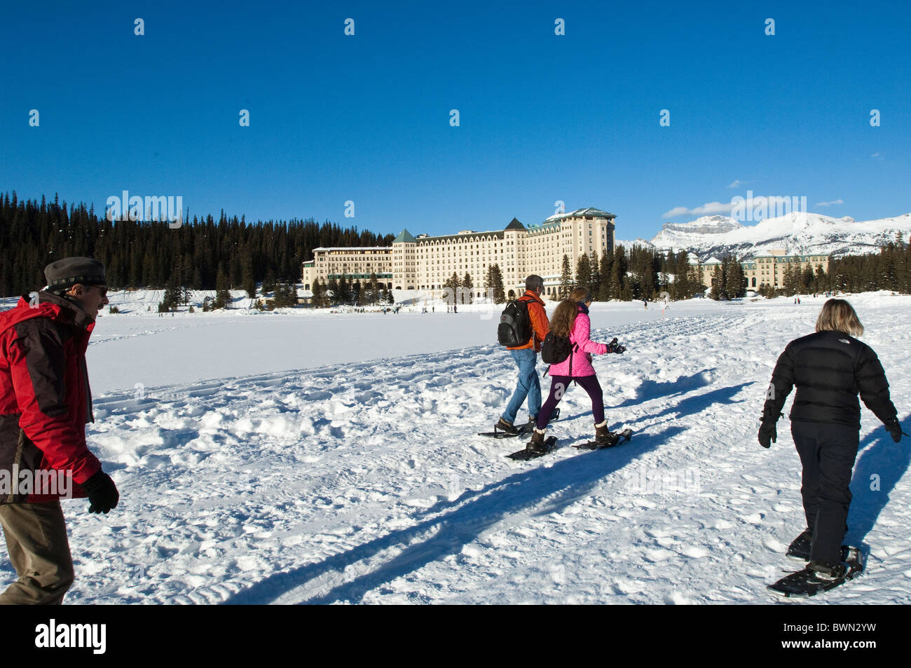 Snowshoeing at Chateau Lake Louise Hotel, Lake Louise, Banff National Park, Alberta, Canada. Stock Photo