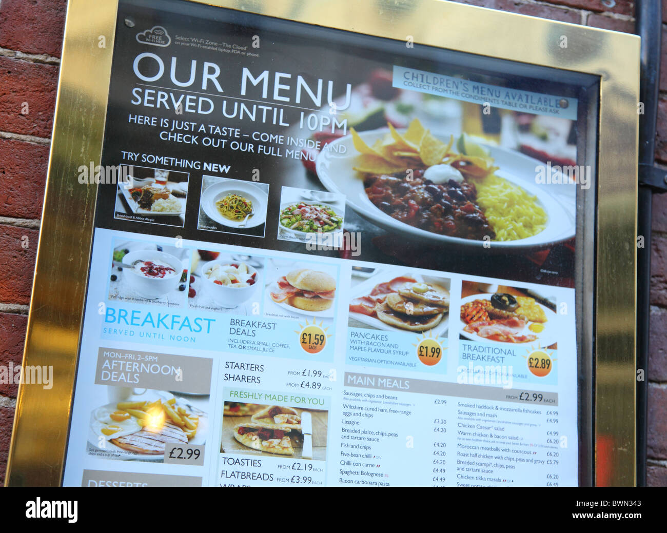 A menu outside a J. D. Wetherspoon bar in a U.K. city. Stock Photo