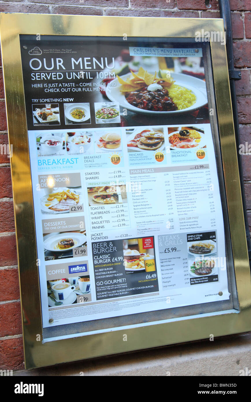 A menu outside a J. D. Wetherspoon bar in a U.K. city. Stock Photo