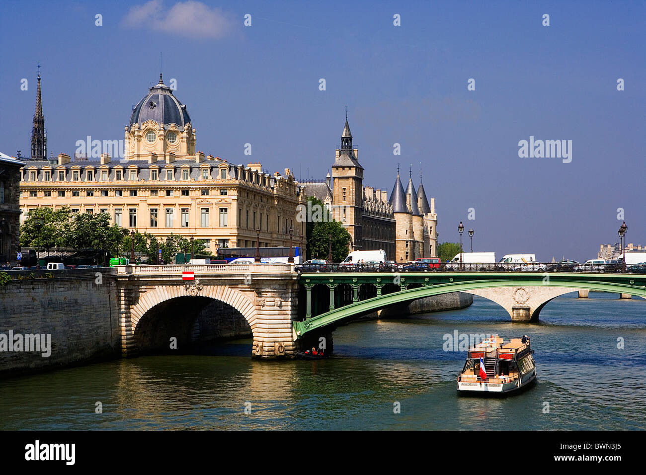 France Europe Paris city Ile de la Cite Palais de Justice Conciergerie Pont au Change River Seine Boat bridg Stock Photo