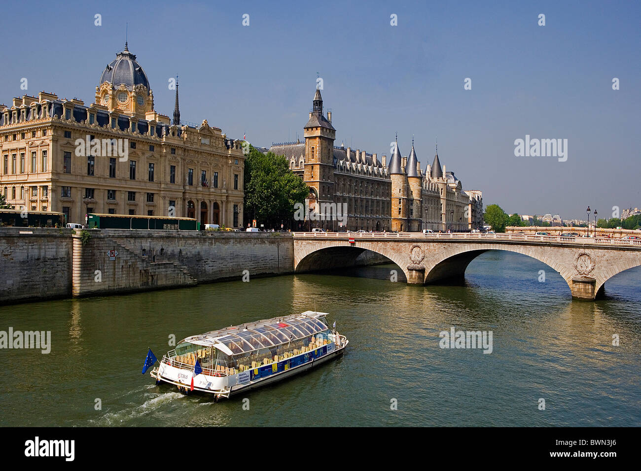 France Europe Paris city Ile de la Cite Palais de Justice Conciergerie Pont au Change River Seine Boat bridg Stock Photo