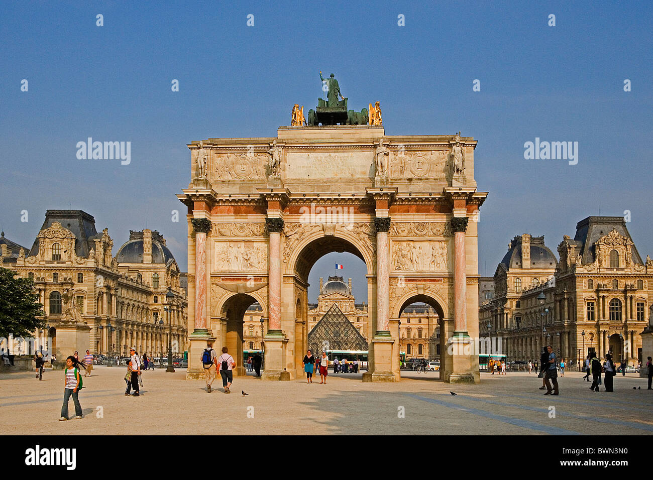 France Europe Paris city Louvre Palace Arc de Triomphe du Carrousel art museum glass pyramid people visitors Stock Photo