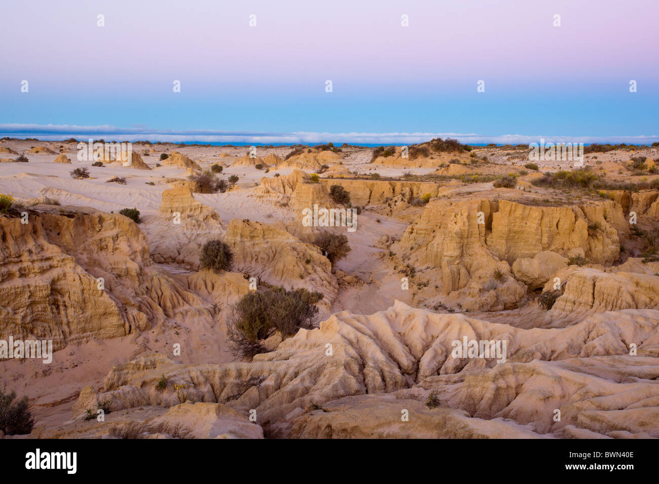 Twilight over the eroded shapes of the Walls of China, Lake Mungo in south west New South Wales Stock Photo