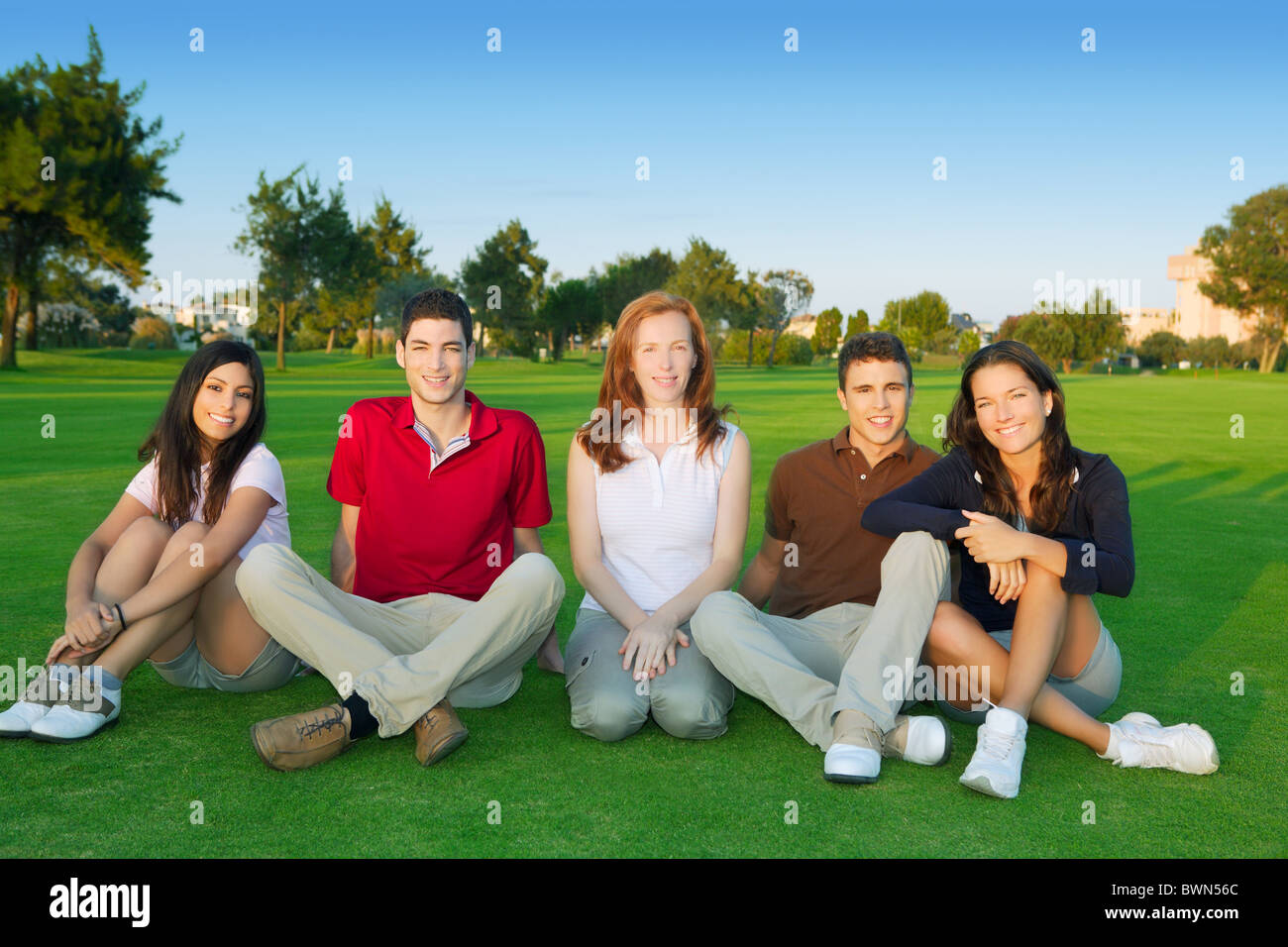 friends group people happy sitting green grass outdoor Stock Photo Alamy