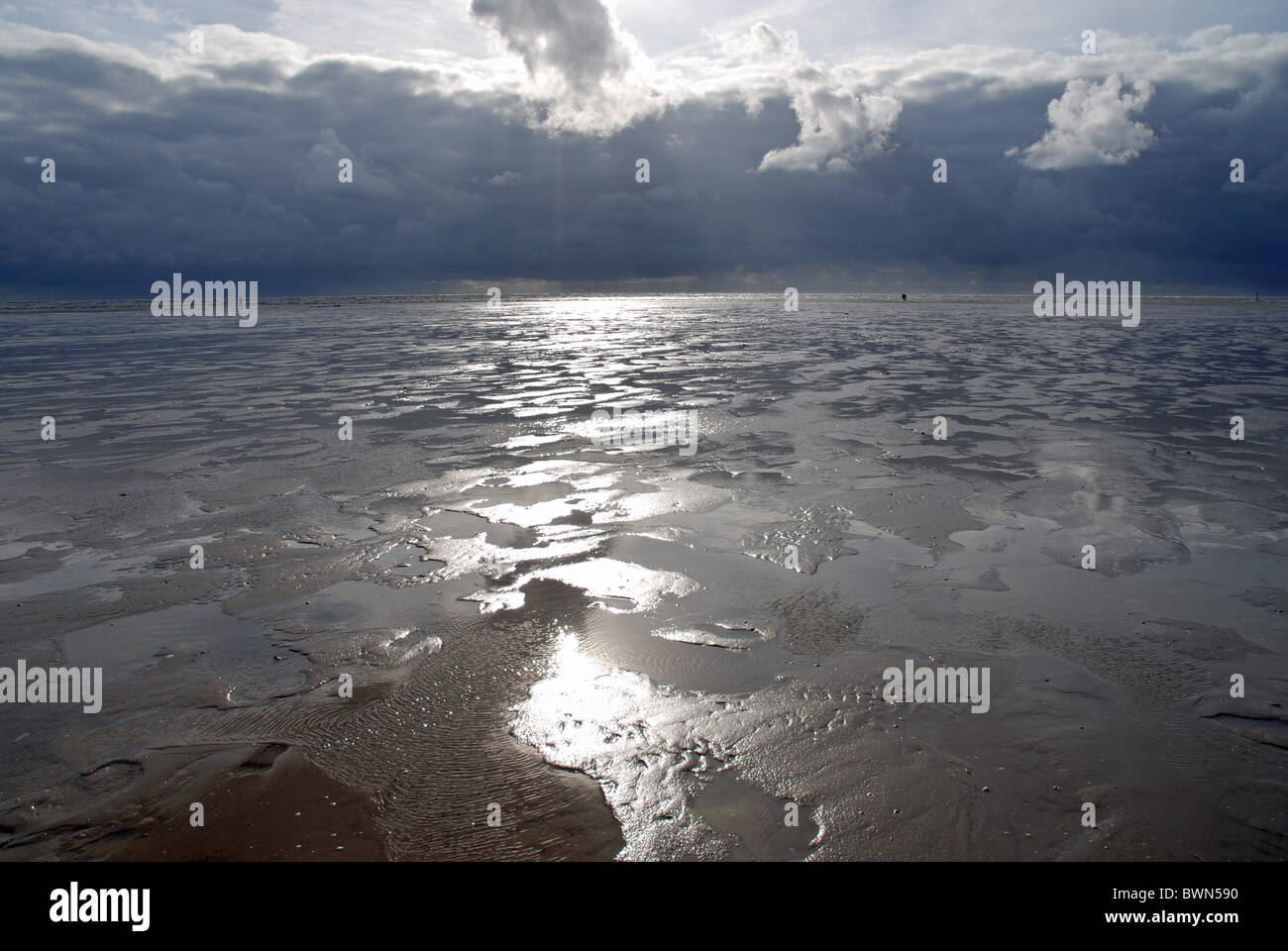 Germany Europe German Bight Europe ebb tide flood tide tides tidal mudflat sky coast coastal landscape Stock Photo