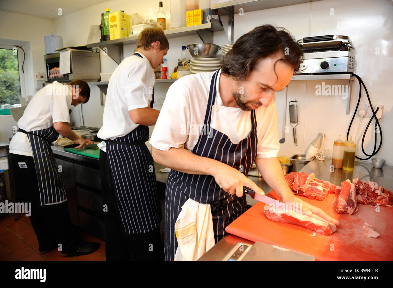 Head Chef Stephen Terry (right) preparing food at The Hardwick restaurant Abergavenny Stock Photo