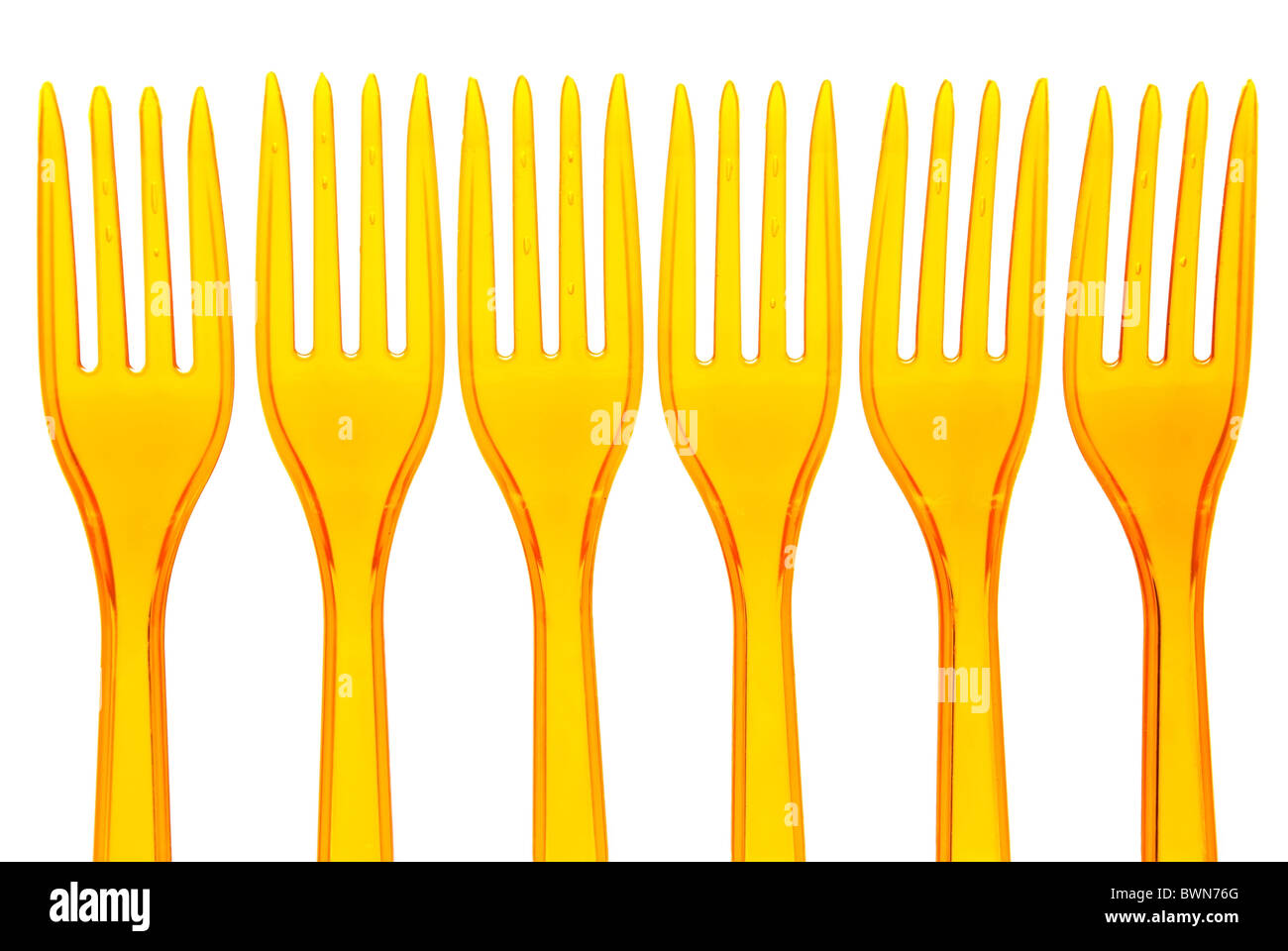 Orange plastic forks over white Stock Photo Alamy