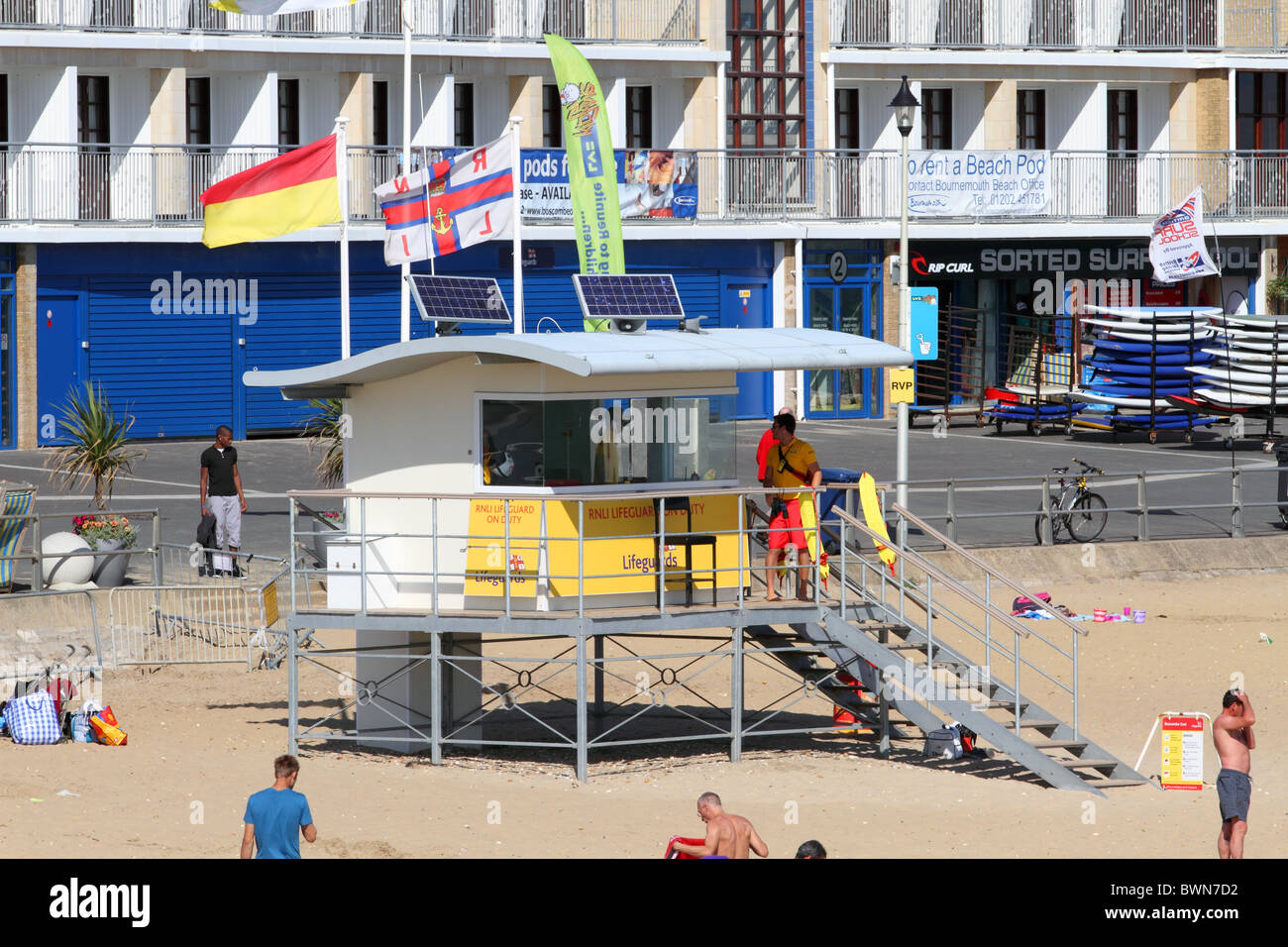 RNLI lifeguard tower on Boscombe beach, Dorset. In the background The Overstrand. Stock Photo