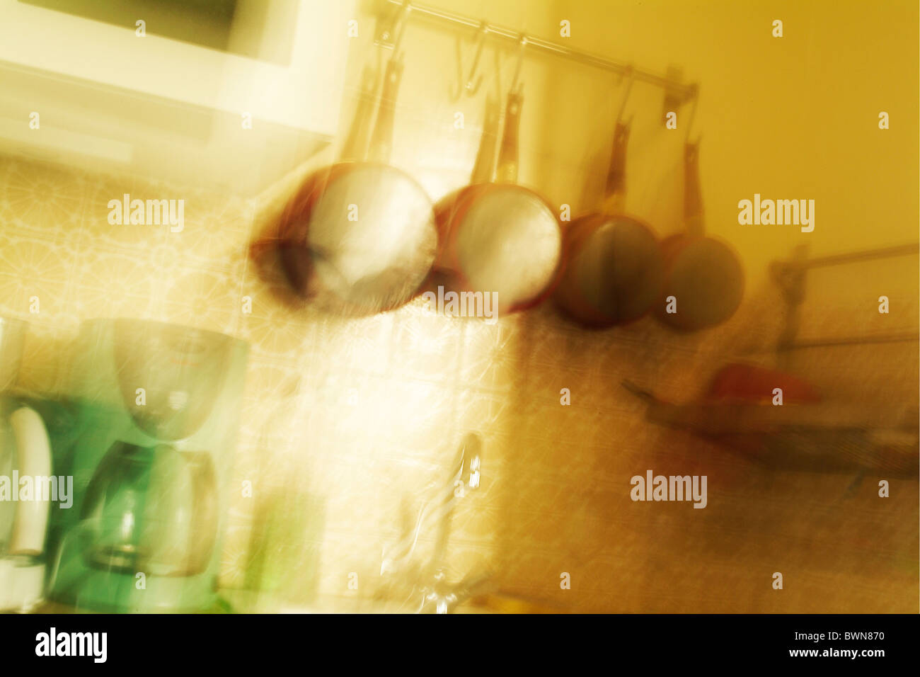 Hanging pots and pans in the kitchen hires stock photography and