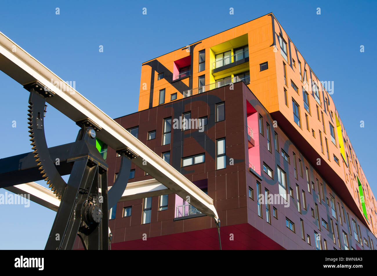 The Chips apartment building, by Will Alsop, from a bridge beside the Ashton Canal, New Islington district, Manchester, UK Stock Photo