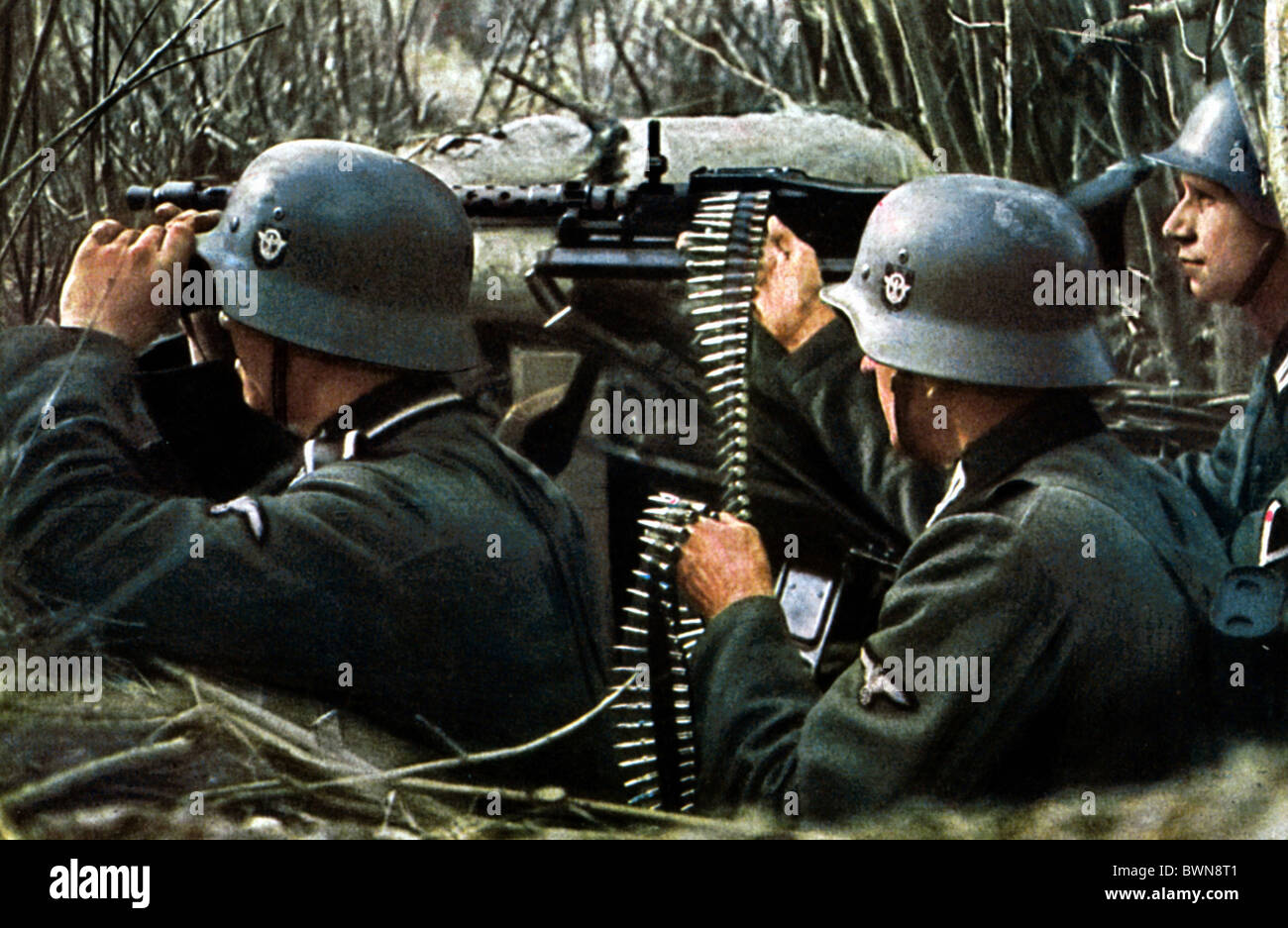 Wehrmacht Nazi Germany Europe dugout soldiers weapon machine gun machinegun Second World War World War II WW Stock Photo