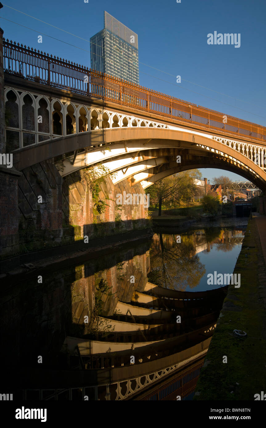The Beetham Tower, (or Hilton Tower), and Victorian railway arch reflected in the Rochdale Canal, Manchester, England, UK Stock Photo