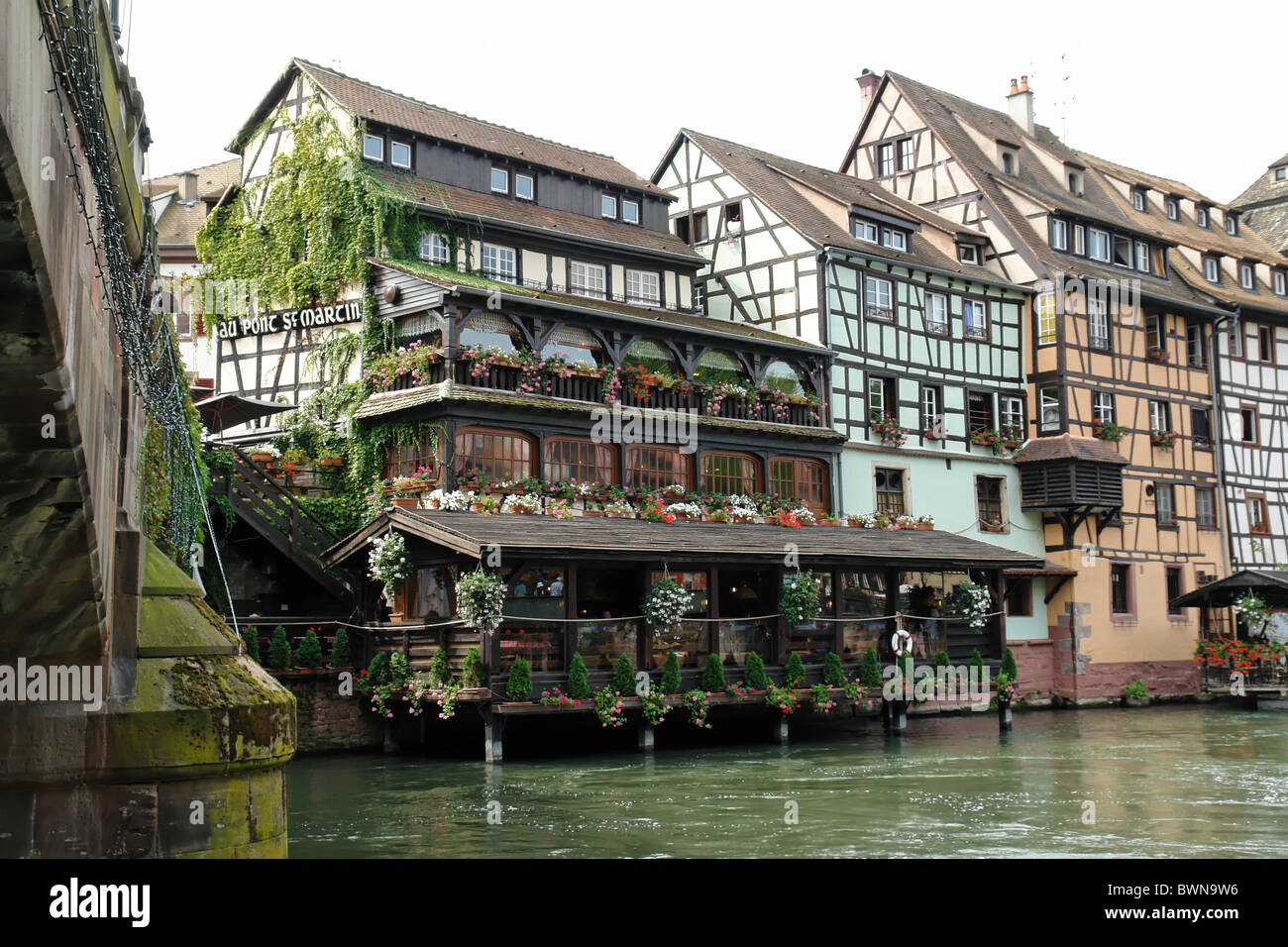 France Europe Bas-Rhin Alsace Strasbourg Strassburg medieval half-timbered houses timber framing river L'Ill Stock Photo