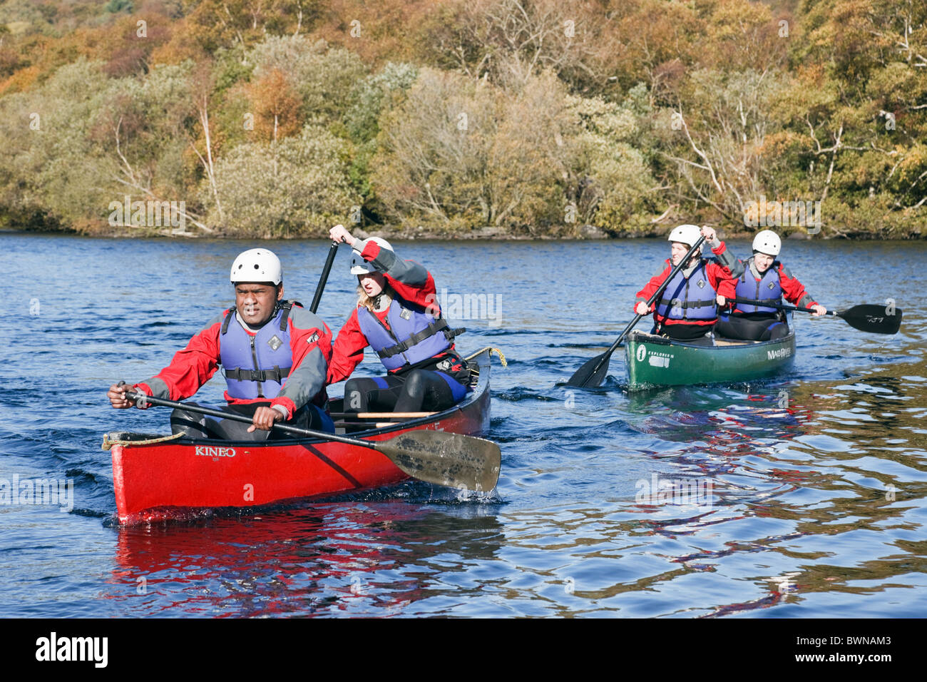 People canoeing in Canadian canoes on Llyn Padarn Lake in Snowdonia