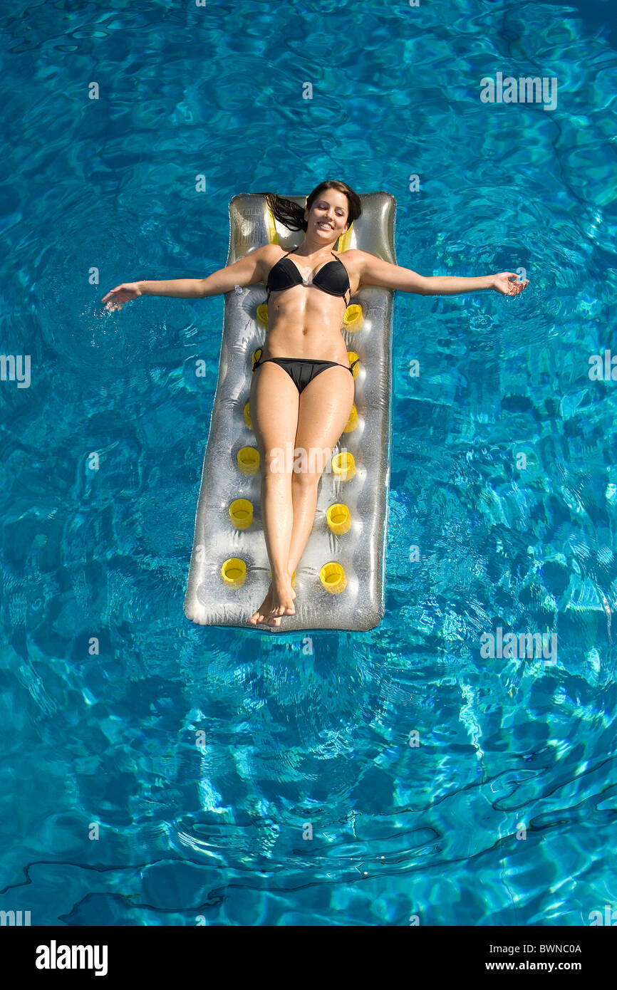 girl in bikini by indoor pool
