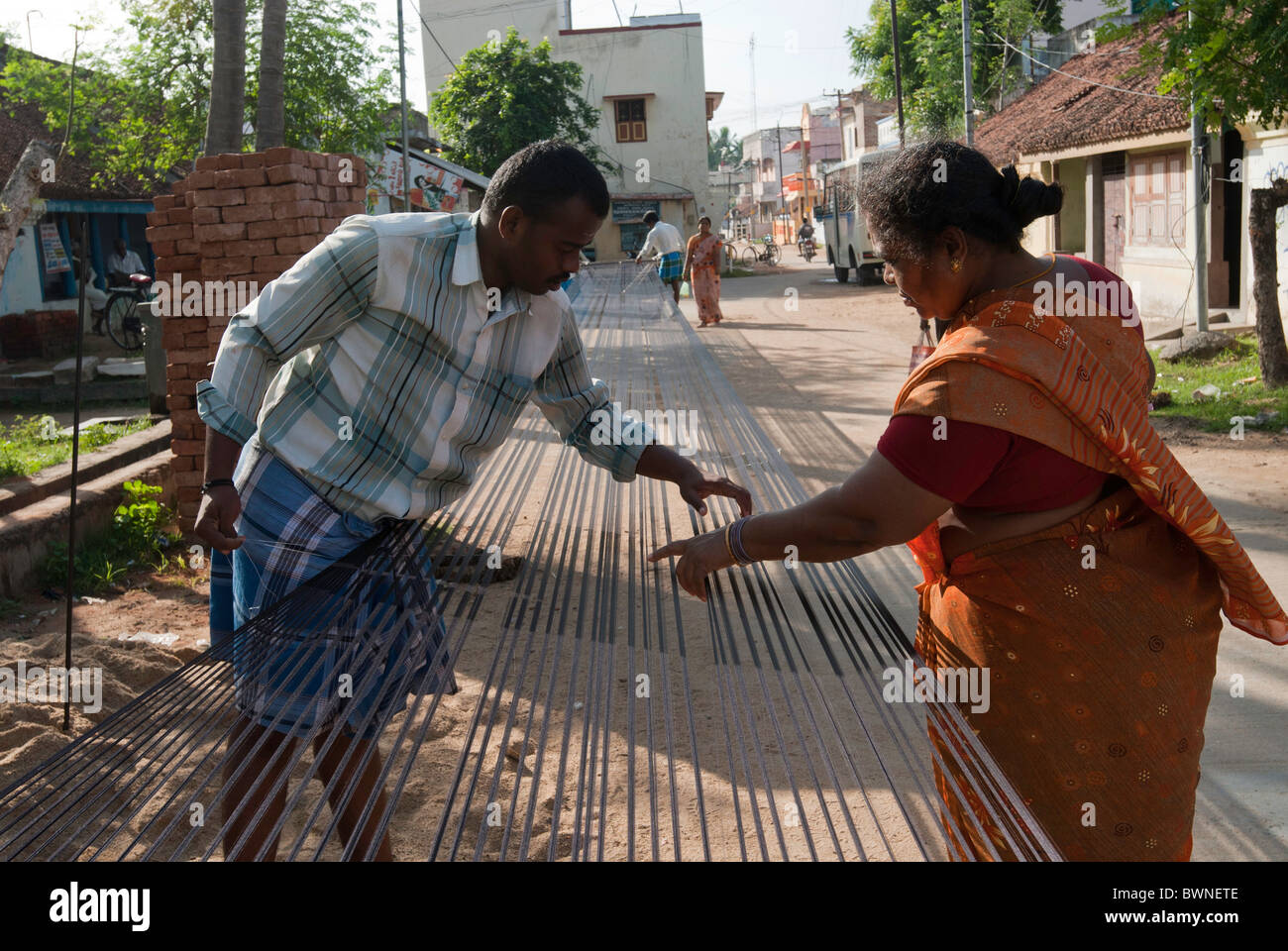 Removing knots and drying silk yarn ; old tradition practiced by