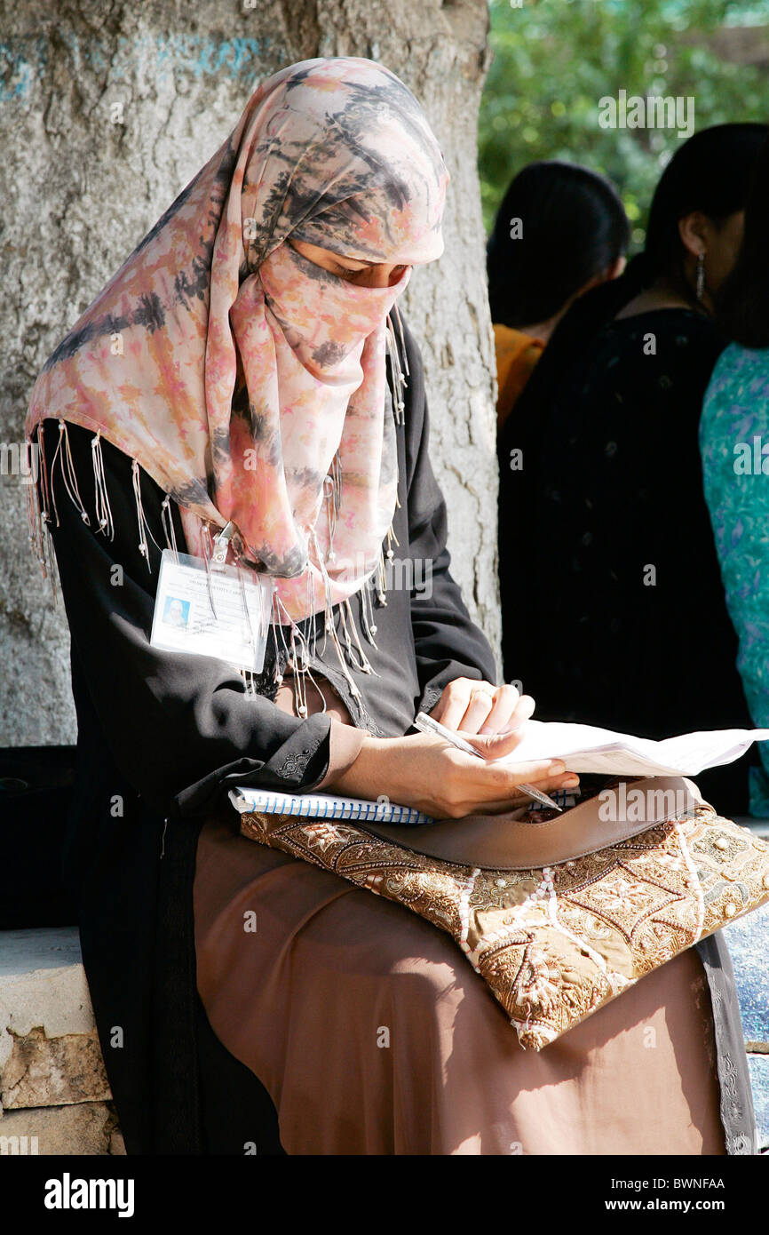 A student sits reading at the all female Fatima Jinnah University in Rawalpindi, Pakistan Stock Photo