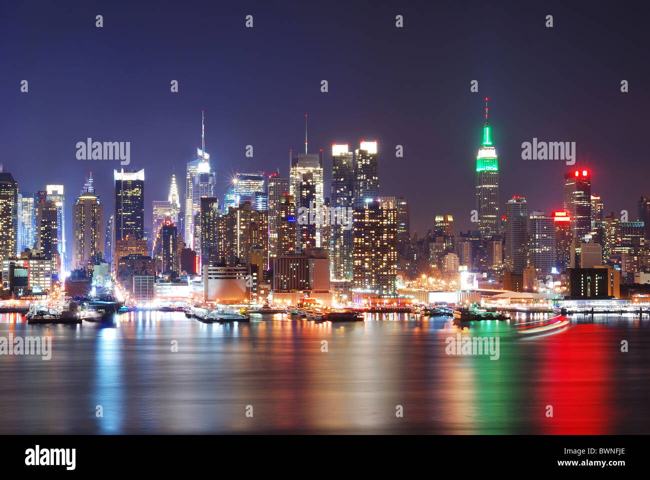 Empire State Building in New York City with Manhattan Skyline at night ...