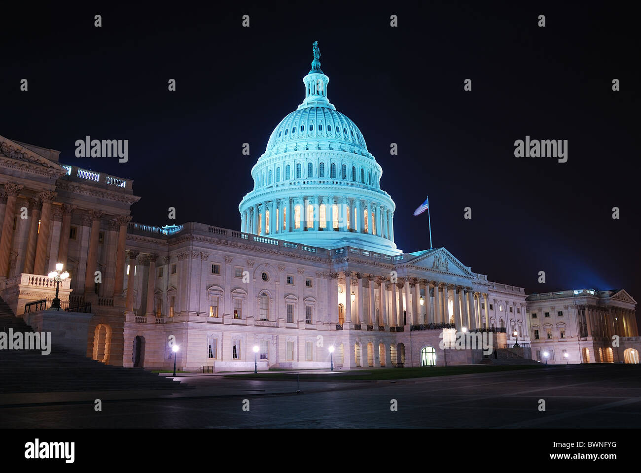 Capitol hill building at night illuminated with light, Washington DC. Stock Photo