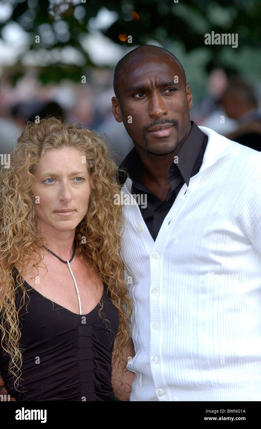 Footballer Sol Campbell with girlfriend, Kelly Hoppen, at a celebrity summer party in Chelsea, London Stock Photo