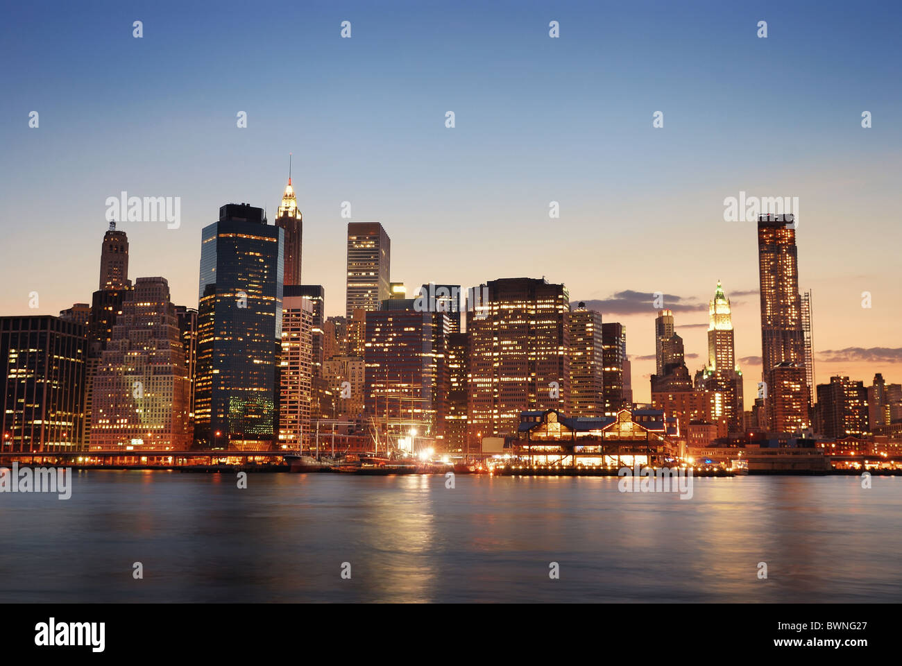 New York City Manhattan skyline at dusk over Hudson River with ...