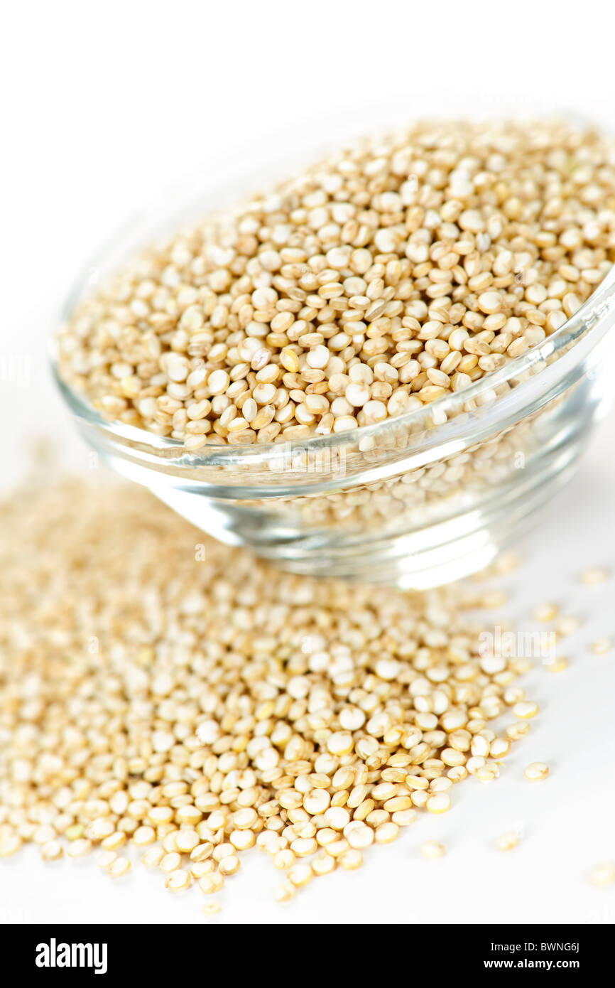 Quinoa grain in glass bowl on white background Stock Photo