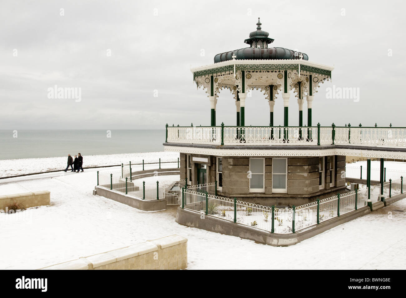 A family walk past  the 'Birdcage' bandstand, Brighton Stock Photo