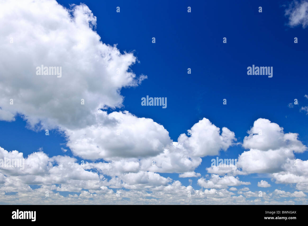 Background of blue sky with white cumulus clouds Stock Photo - Alamy