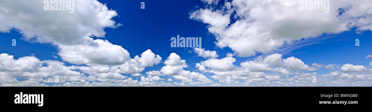 Panoramic background of blue sky with white cumulus clouds Stock Photo ...