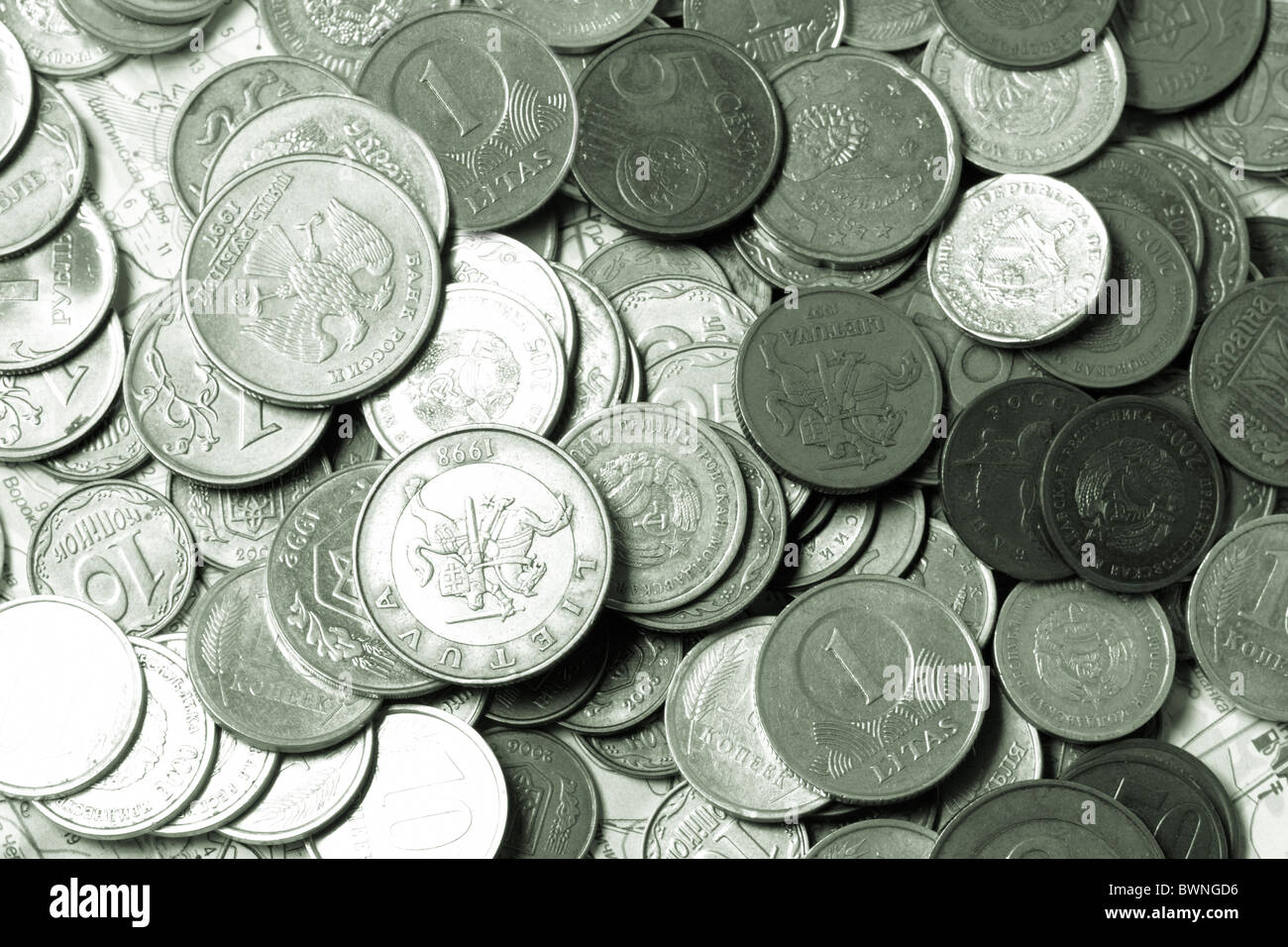 Coins lay on a map Stock Photo