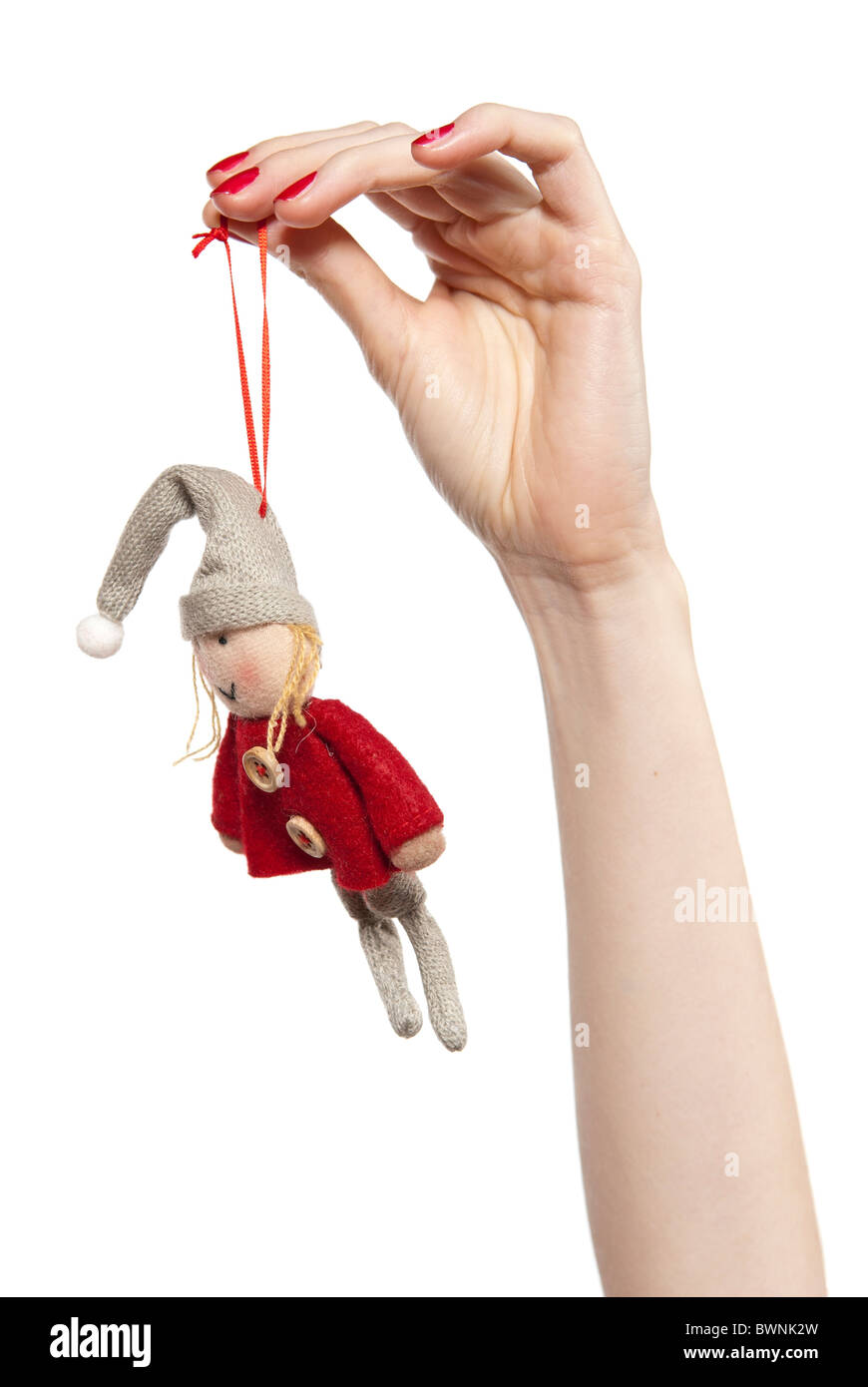 Studio photo of fwoman's hands playing with puppet. Dwarf on the white background. Stock Photo